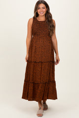 woman wearing an orange and brown leopard print maternity maxi dress with tiered layers and a fitted bodice
