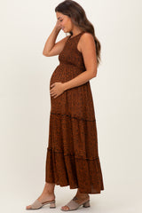 woman wearing a brown leopard print maternity maxi dress and showing her baby bump