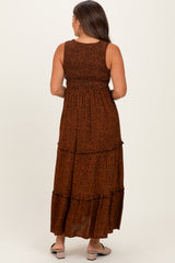 woman wearing a brown leopard print maternity maxi dress with tiered layers and a fitted bodice, showing her baby bump