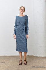woman wearing a blue striped long sleeve dress with a tie waist detail