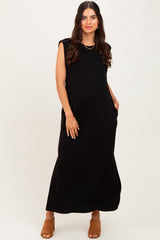 woman wearing a black sleeveless maxi dress with pockets and a relaxed fit