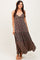 woman wearing a dark floral print maxi dress with a tie front and a tiered skirt