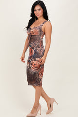 woman wearing a form-fitting floral print bodycon dress with spaghetti straps and a scoop neckline