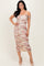 woman wearing a floral off-the-shoulder midi dress with ruching and a bodycon fit