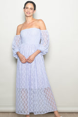 woman wearing a lavender off-the-shoulder long sleeve lace maxi dress with a smocked bodice and puff sleeves