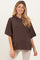 woman wearing a brown short sleeve maternity hoodie with a relaxed fit