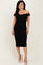 woman wearing a black off-the-shoulder fitted dress with ruching and a midi length