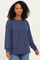 woman wearing a navy blue ribbed long sleeve sweater with a relaxed fit and balloon sleeves