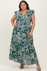woman wearing a green floral print plus size maxi dress with ruffled sleeves and a deep v-neckline