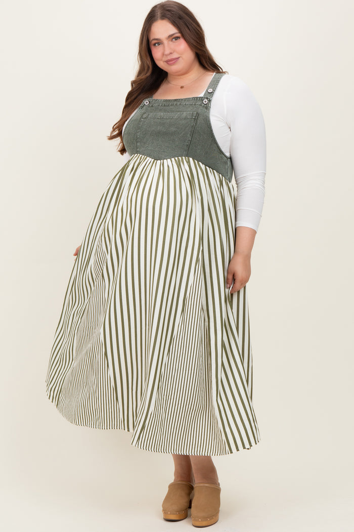 woman wearing a green and white striped maternity plus dress with a fitted top and flowy skirt, showing her baby bump