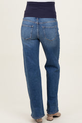 woman wearing blue maternity jeans with a navy underbump waistband, showing the back view