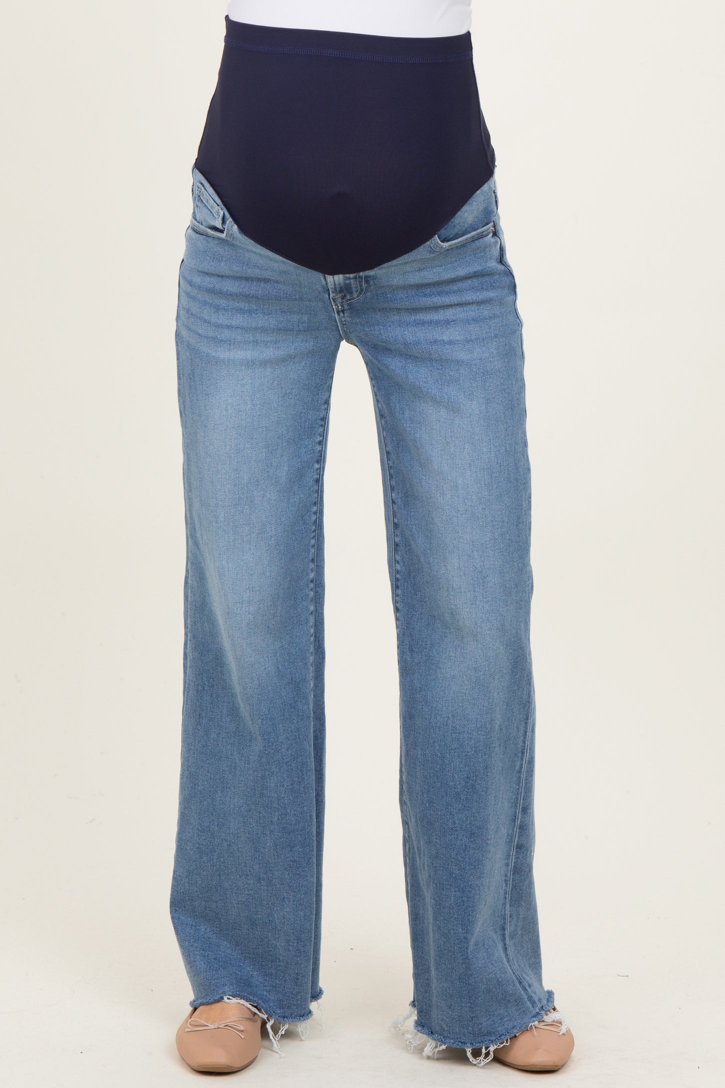 maternity wear light wash wide leg jeans with a stretchy navy over-the-bump waistband
