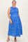 woman wearing a bright blue floral maternity dress with a smocked bodice and a flowing skirt, showcasing her baby bump