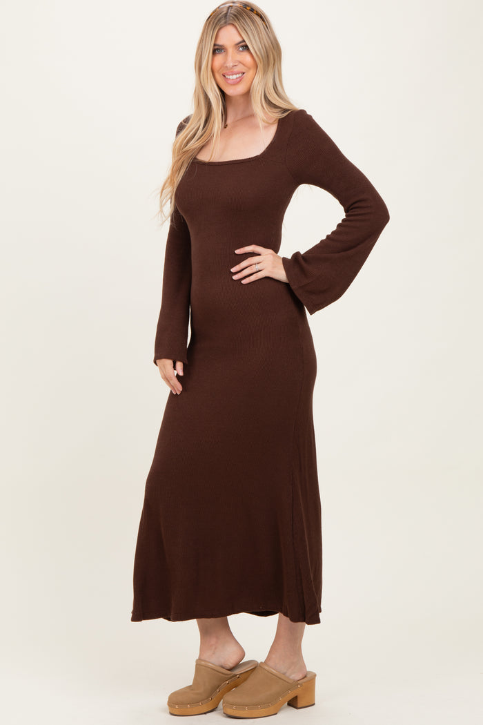 woman wearing a brown long sleeve ribbed maxi dress and beige platform clogs