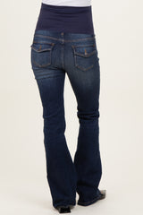 woman wearing dark blue maternity bootcut jeans with a navy underbelly panel, showing the back view
