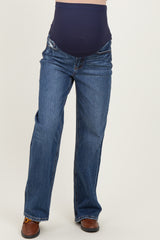 woman wearing a pair of dark blue maternity jeans with a stretchy belly panel and a relaxed fit