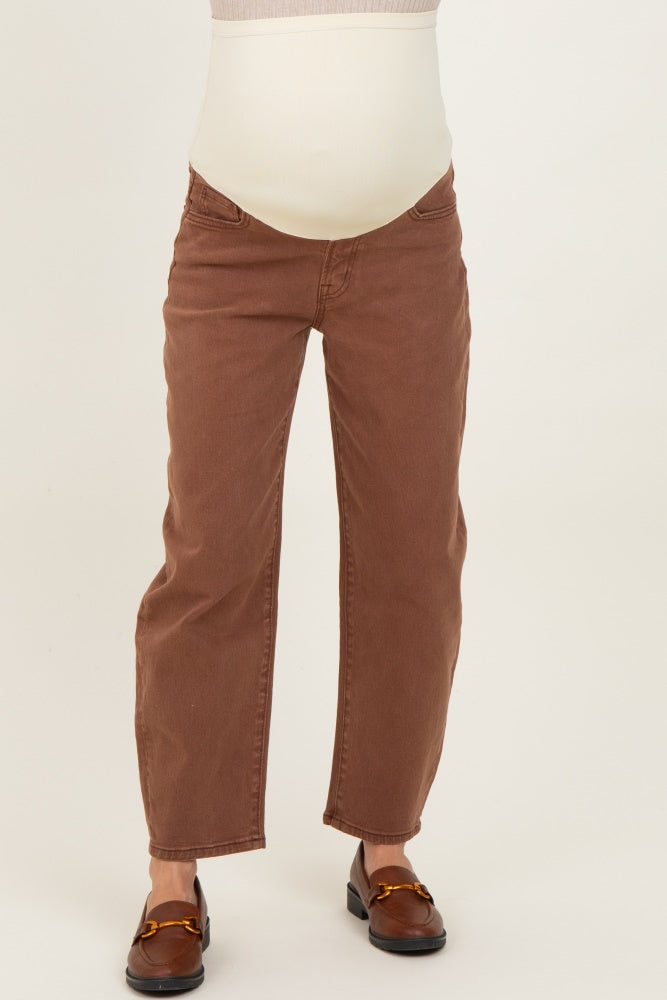 woman wearing light brown maternity jeans with a stretchy belly panel