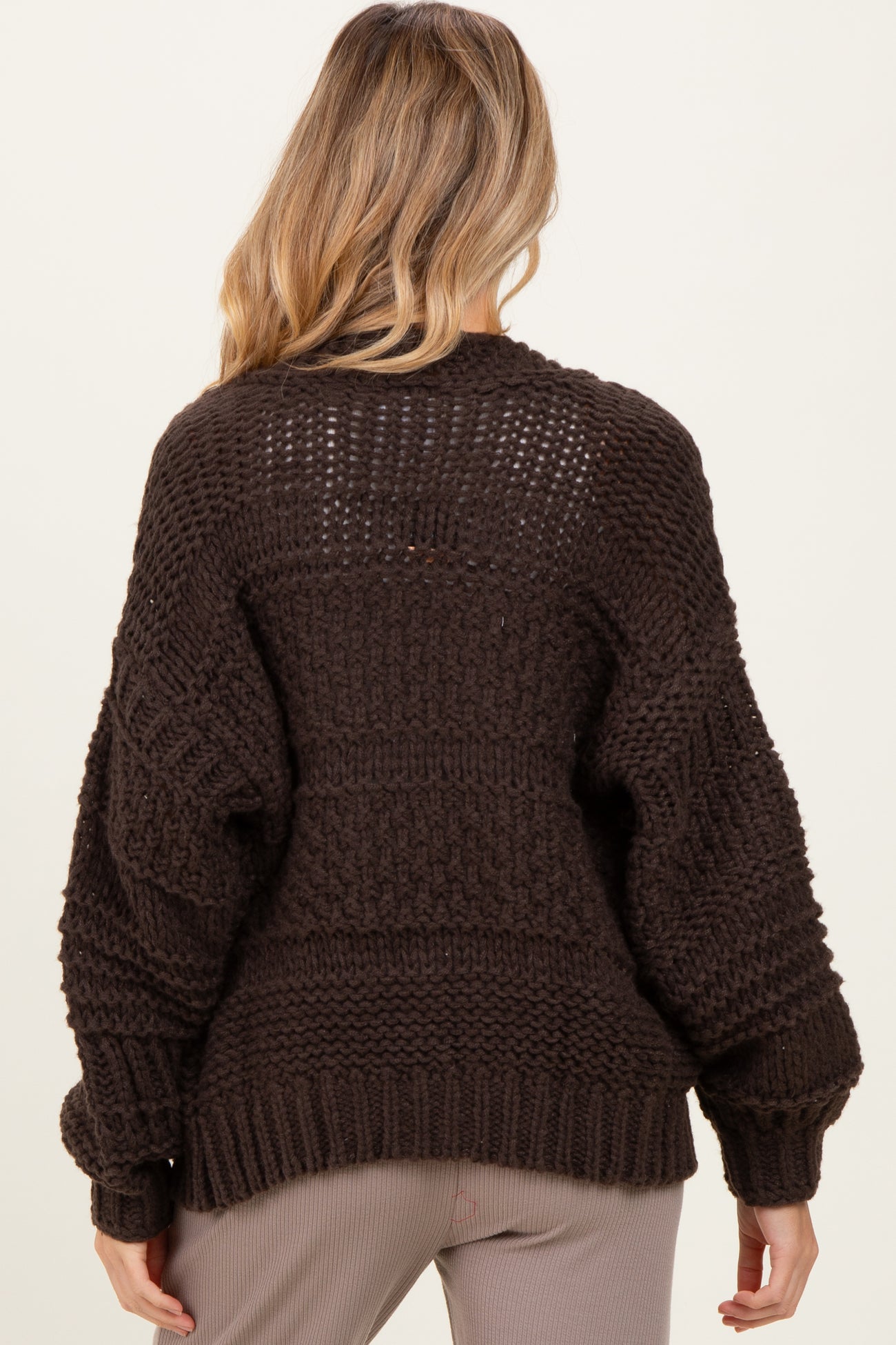maternity wear dark brown chunky knit sweater with oversized fit and textured detail, shown from the back