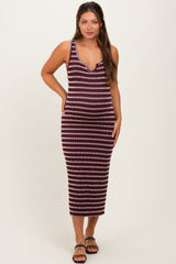 woman wearing a burgundy and cream striped maternity tank dress with a deeper v-neckline and a fitted silhouette