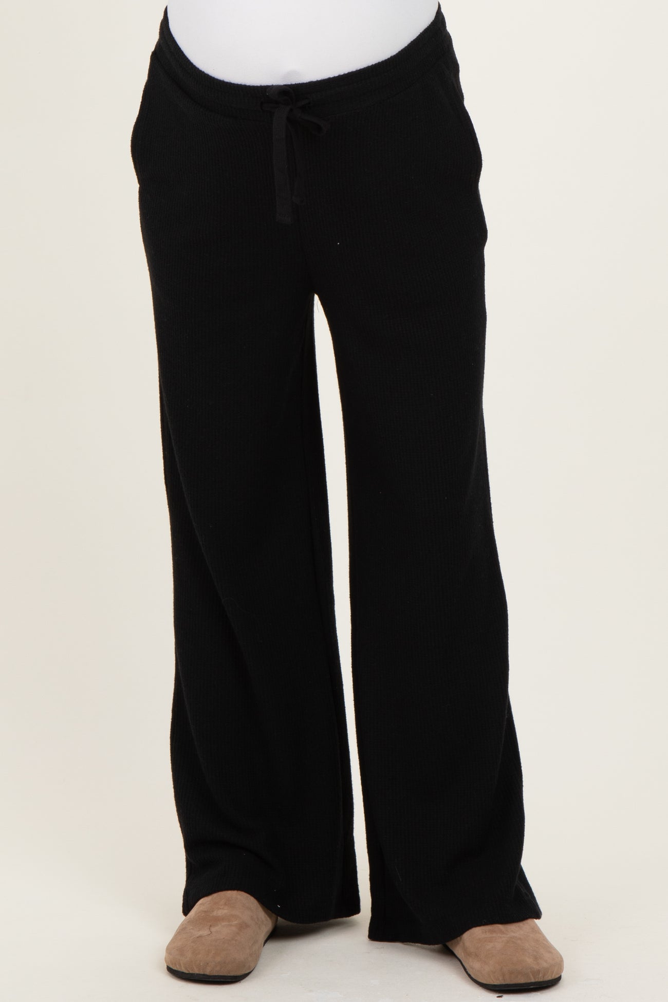 black maternity lounge pants with wide leg and drawstring waistband displayed on a white background