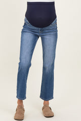 woman wearing blue maternity jeans with a navy belly band and a straight leg cut