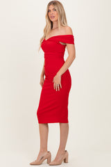 woman wearing a red off-the-shoulder midi dress with a fitted silhouette and a side slit