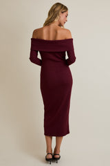 woman wearing a fitted off-the-shoulder maroon ribbed midi dress, showing the back view
