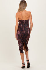 maternity wear dark maroon strapless dress with ruching and a side slit, model viewed from the back