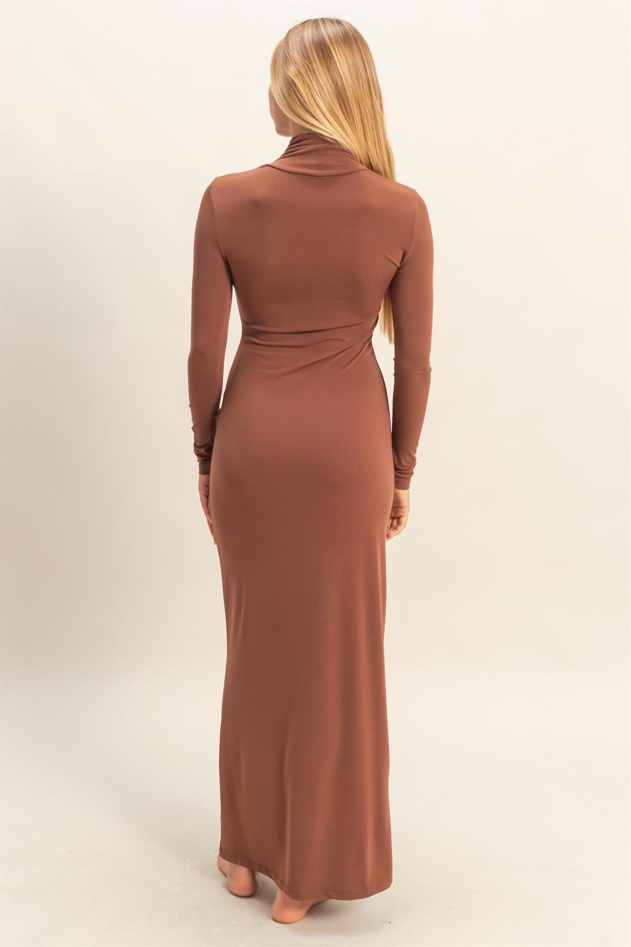 woman wearing a brown long sleeve bodycon maxi dress, shown from the back