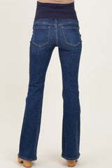 woman wearing dark blue maternity jeans with a wide band at the waist, viewed from the back