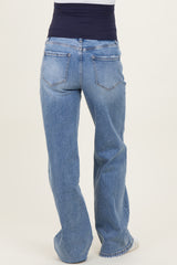 maternity wear light blue wide-leg jeans with a navy blue waistband, shown from the back