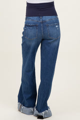 woman wearing blue maternity jeans with a stretchy waistband and frayed hem details, viewed from the back
