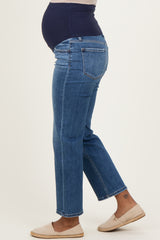 woman wearing dark blue maternity jeans with a stretch belly panel, showcasing a baby bump