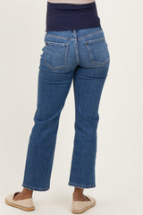 woman wearing dark blue maternity jeans with a wide waistband, showing the back view of the pants