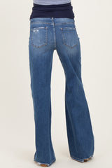 maternity wear blue flared jeans with a high waistband, model seen from behind