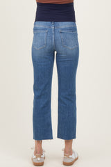 woman wearing blue maternity cropped jeans with a stretchy waistband, seen from the back