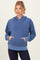 woman wearing a blue maternity hoodie with a front pocket and relaxed fit, showcasing a baby bump