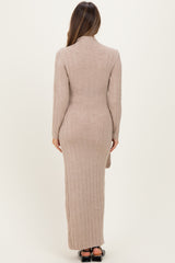 woman wearing a light brown ribbed maternity maxi dress viewed from the back with a fitted silhouette.