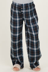 woman wearing navy and white plaid maternity lounge pants with an elastic waistband and front buttons