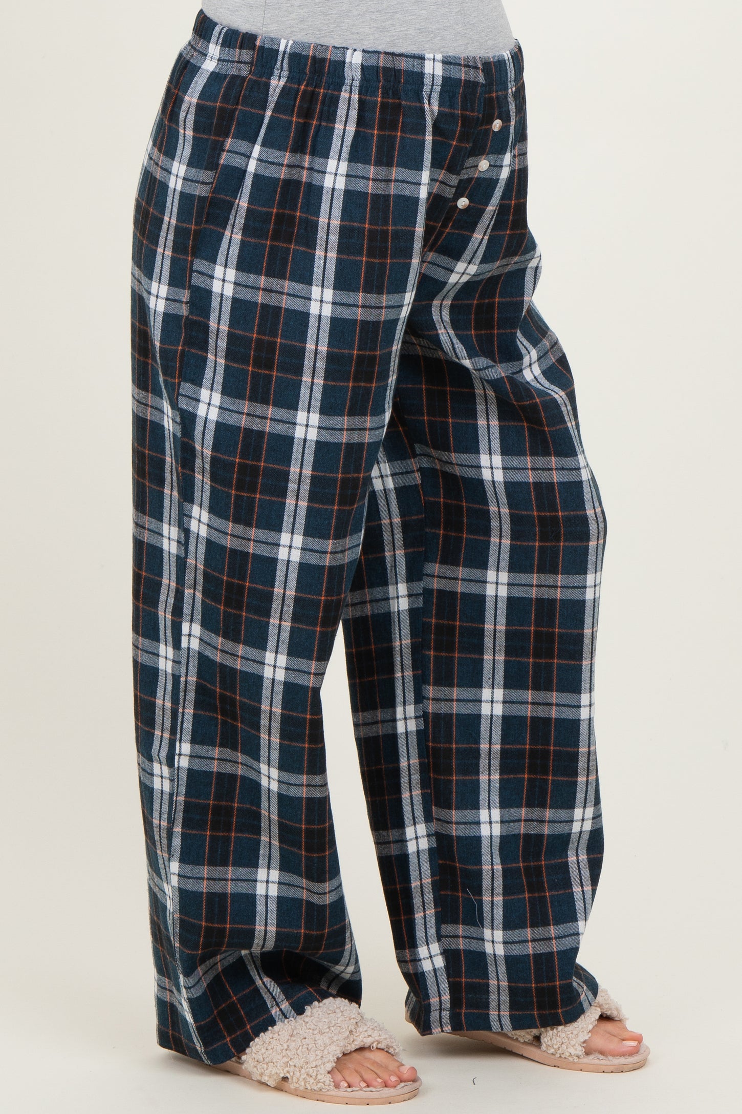 woman wearing navy blue and white plaid maternity pants with a relaxed fit and elastic waistband