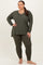 woman wearing an olive green long sleeve top and matching leggings in a plus size fit