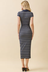 woman wearing a fitted navy and white striped midi dress with short sleeves and a collar, viewed from the back
