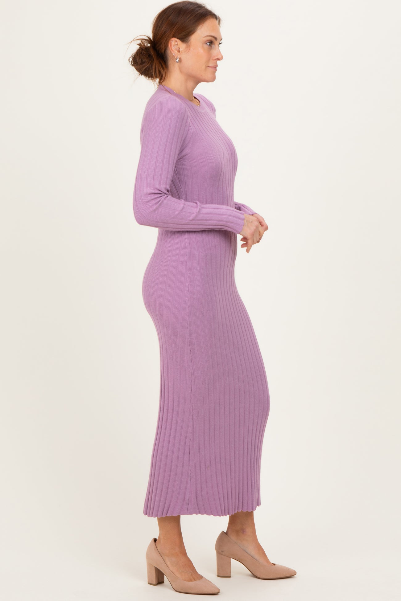 woman wearing a long sleeve ribbed lavender maxi dress and beige heels