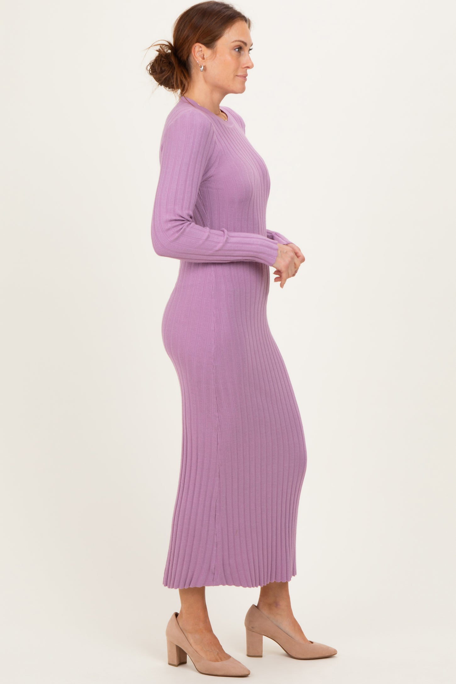 woman wearing a long sleeve ribbed lavender maxi dress and beige heels