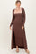 woman wearing a brown ribbed maxi dress with a long cardigan, styled with tan flats and hair in a loose updo