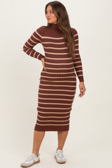 woman wearing a brown and striped long sleeve maternity dress with a fitted silhouette and relaxed fit