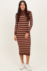 woman wearing a brown and beige striped ribbed midi dress with long sleeves and a high neckline, paired with white sneakers