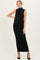 woman wearing a black ribbed maternity maxi dress with a high neck and a visible baby bump