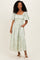 woman wearing a light green floral maxi dress with puff sleeves and a square neckline
