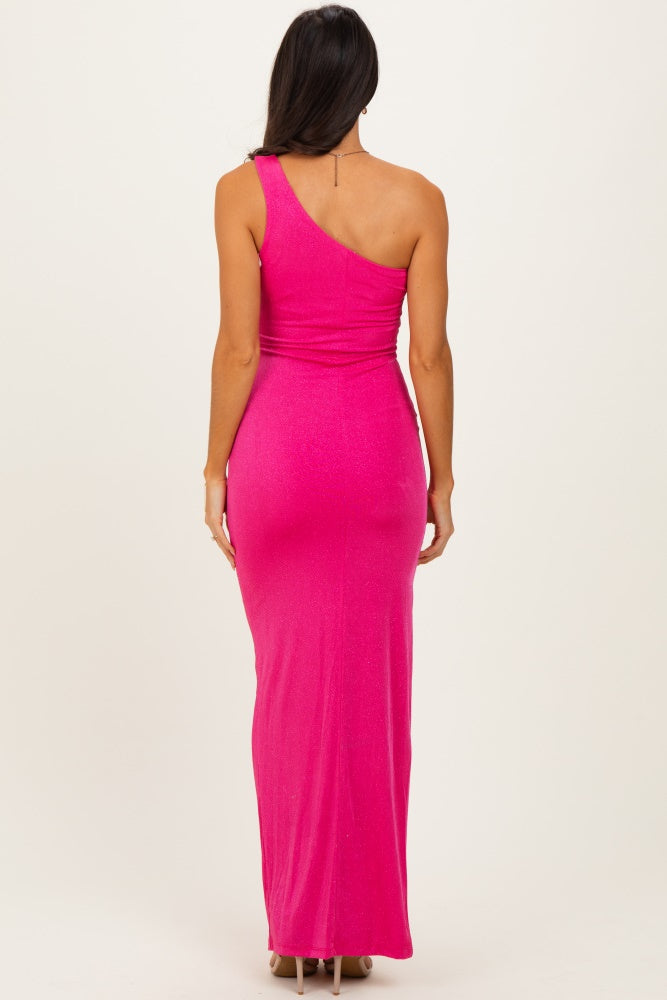 woman wearing a form-fitting hot pink one-shoulder maxi dress showing a sleek silhouette from the back
